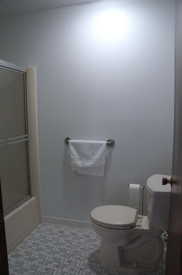 8449 Mathias Dr Unit 17, Grosse Ile, MI 48138 - full bathroom featuring toilet, baseboards, enclosed tub / shower combo, and tile patterned flooring