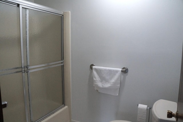 8449 Mathias Dr Unit 17, Grosse Ile, MI 48138 - full bath featuring toilet, a shower with shower door, and baseboards