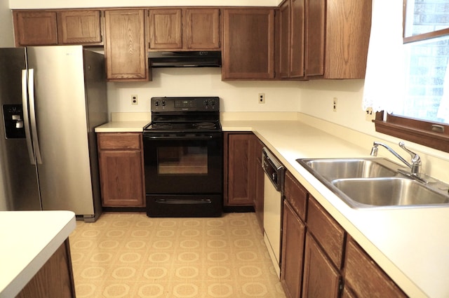8449 Mathias Dr Unit 17, Grosse Ile, MI 48138 - kitchen featuring stainless steel fridge, black range with electric cooktop, under cabinet range hood, a sink, and light countertops