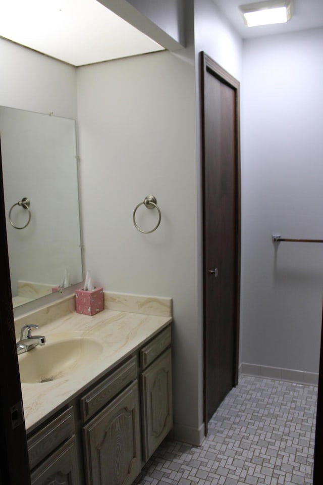 8449 Mathias Dr Unit 17, Grosse Ile, MI 48138 - bathroom featuring vanity and baseboards