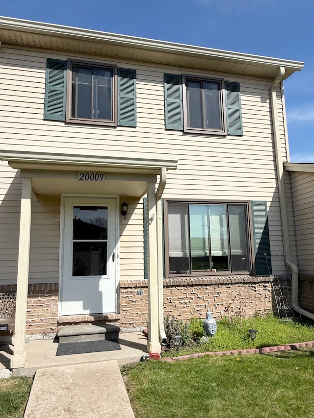 view of front of home with brick siding