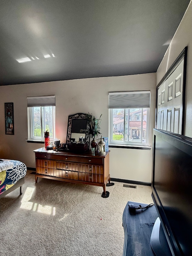 interior space with baseboards and visible vents