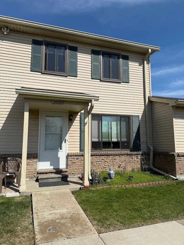 view of front of house with brick siding
