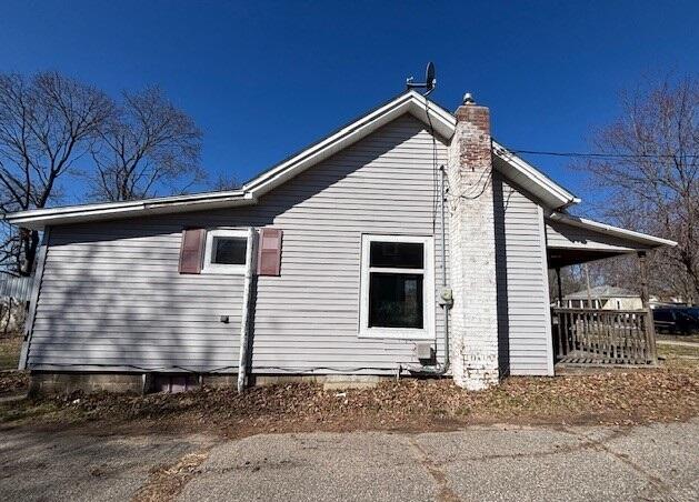 view of home's exterior featuring a chimney
