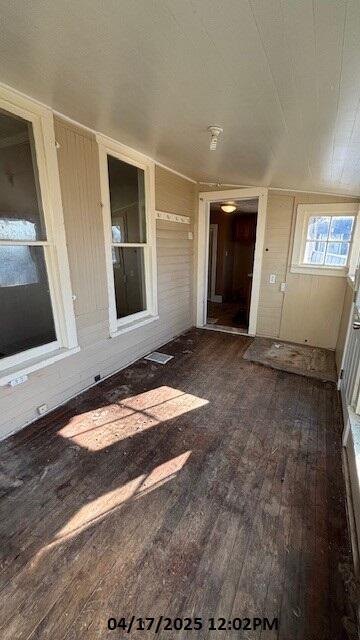 exterior space with dark wood-style flooring