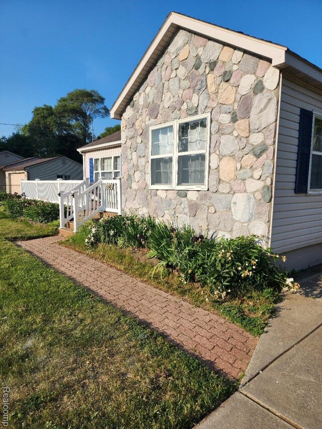 5140 Eastview Rd, Clarkston, MI 48346 - view of property exterior featuring stone siding