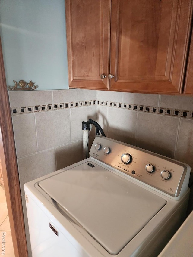 5140 Eastview Rd, Clarkston, MI 48346 - washroom featuring washer / dryer and cabinet space