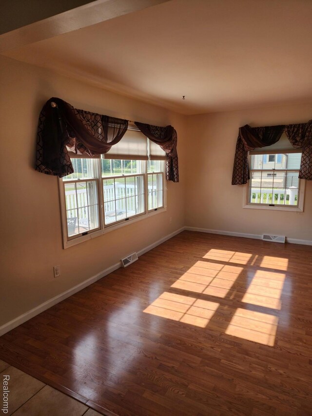 5140 Eastview Rd, Clarkston, MI 48346 - spare room with baseboards and wood finished floors