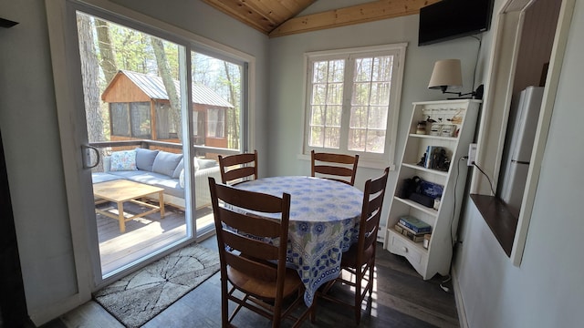 dining area with wood ceiling, lofted ceiling, and dark wood-style floors