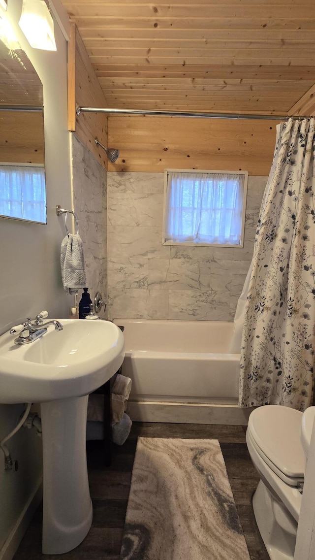 bathroom with shower / tub combo, wooden ceiling, wood finished floors, and toilet
