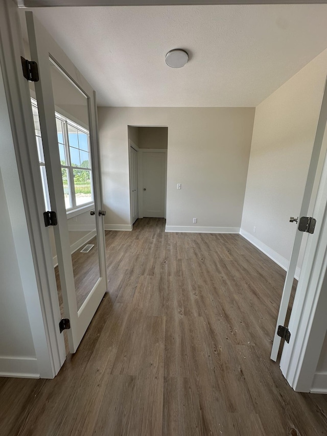 6669 Yamoto Way Lot 7, Douglas, MI 49406 - empty room featuring dark wood-type flooring and french doors