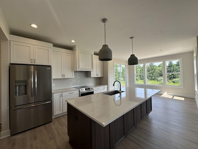 6669 Yamoto Way Lot 7, Douglas, MI 49406 - kitchen featuring stainless steel appliances, dark wood-style floors, healthy amount of natural light, white cabinets, and recessed lighting