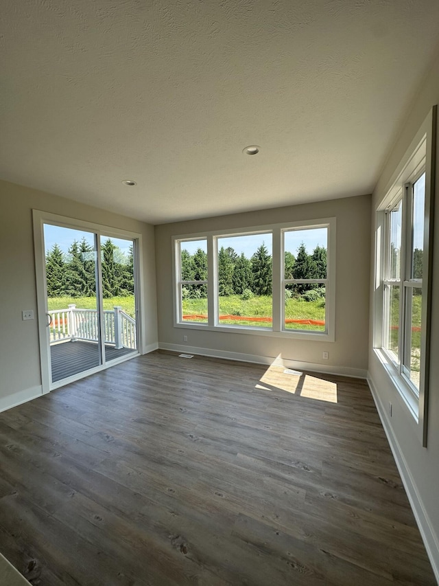 6669 Yamoto Way Lot 7, Douglas, MI 49406 - unfurnished room featuring healthy amount of natural light, dark wood finished floors, and recessed lighting