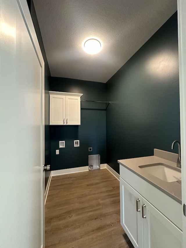 6669 Yamoto Way Lot 7, Douglas, MI 49406 - washroom with wood finished floors, electric dryer hookup, hookup for a washing machine, a textured ceiling, and cabinet space