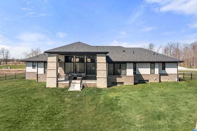 73404 Castle, Armada, MI 48005 - back of property with brick siding, a patio area, a shingled roof, and outdoor lounge area
