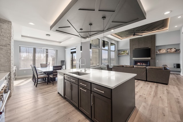 73404 Castle, Armada, MI 48005 - kitchen with a sink, a raised ceiling, a fireplace, light countertops, and recessed lighting
