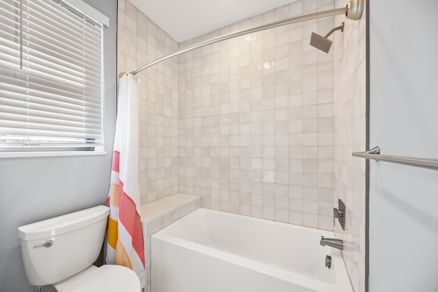 full bathroom featuring shower / tub combo and toilet