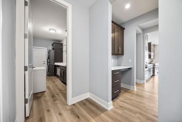 hall featuring recessed lighting, light wood-type flooring, and baseboards