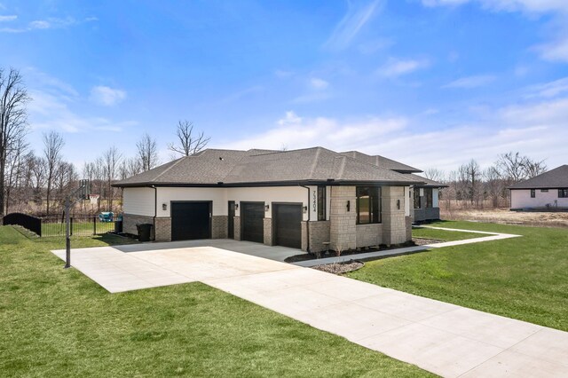 73404 Castle, Armada, MI 48005 - view of front of house with brick siding, a garage, driveway, and a shingled roof