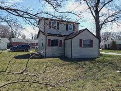 22419 Hoffman St, Saint Clair Shores, MI 48082 - rear view of property with a lawn