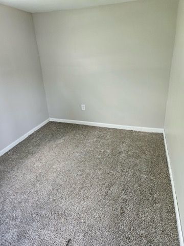 22419 Hoffman St, Saint Clair Shores, MI 48082 - carpeted empty room featuring baseboards