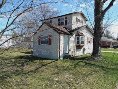 22419 Hoffman St, Saint Clair Shores, MI 48082 - view of side of home with a lawn