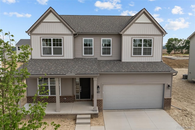 27154 Gallop Way, Saline, MI 48176 - view of front of property with covered porch, brick siding, a garage, and driveway
