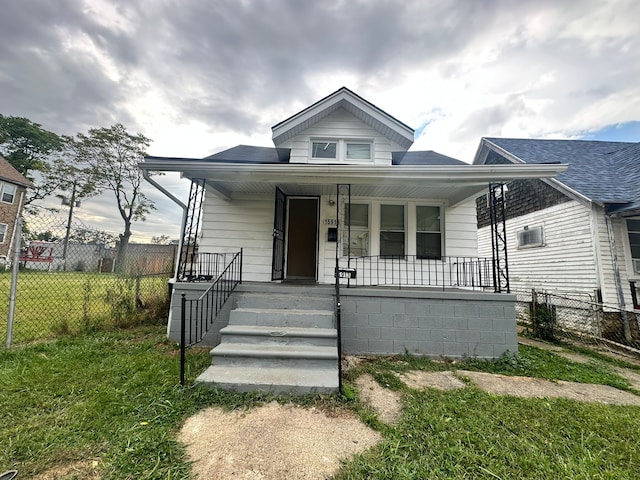 15913 Petoskey Ave, Detroit, MI 48238 - bungalow featuring fence, a porch, and a front yard