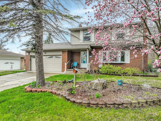 826 Hendricks Dr, Monroe, MI 48162 - traditional-style house with concrete driveway, brick siding, a chimney, and a garage