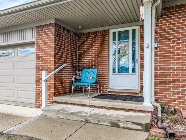 826 Hendricks Dr, Monroe, MI 48162 - entrance to property with brick siding and a garage