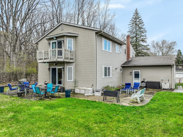 826 Hendricks Dr, Monroe, MI 48162 - back of property featuring a chimney, a patio, a yard, and a balcony