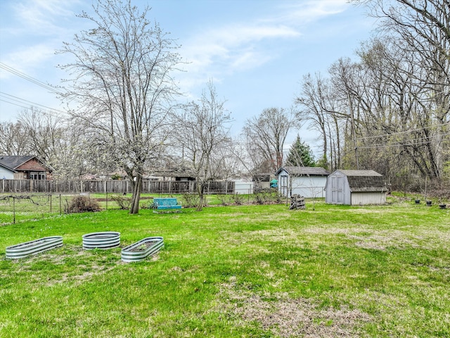 826 Hendricks Dr, Monroe, MI 48162 - view of yard featuring fence, an outbuilding, and a storage unit