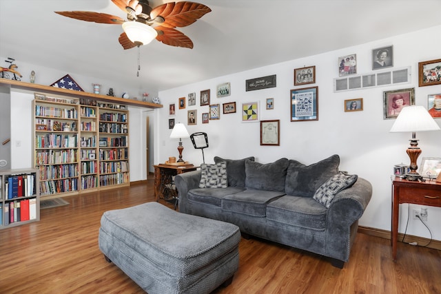 826 Hendricks Dr, Monroe, MI 48162 - living room featuring wood finished floors, baseboards, and ceiling fan