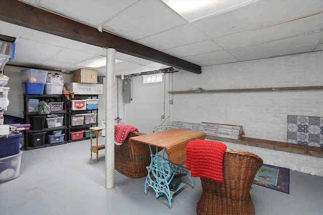826 Hendricks Dr, Monroe, MI 48162 - below grade area with brick wall and a drop ceiling