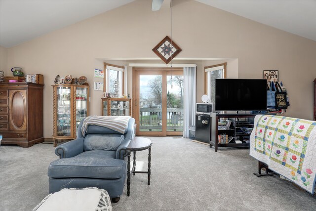 826 Hendricks Dr, Monroe, MI 48162 - carpeted living room with high vaulted ceiling and ceiling fan