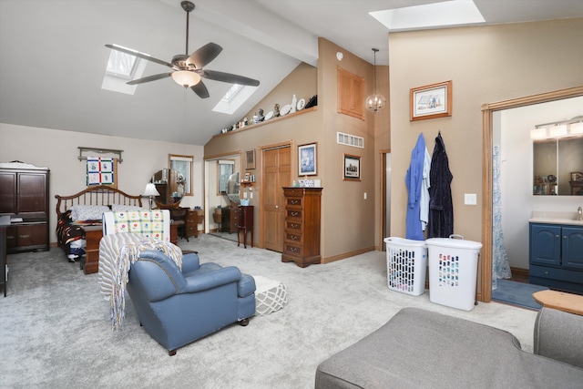 826 Hendricks Dr, Monroe, MI 48162 - carpeted living area with beam ceiling, visible vents, a skylight, a ceiling fan, and high vaulted ceiling