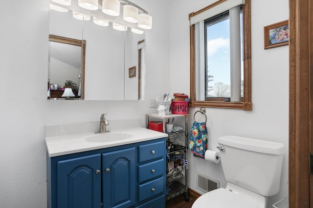 826 Hendricks Dr, Monroe, MI 48162 - bathroom featuring visible vents, vanity, and toilet