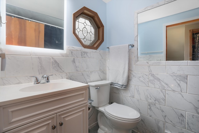 826 Hendricks Dr, Monroe, MI 48162 - full bath featuring tile walls, toilet, vanity, and a wainscoted wall