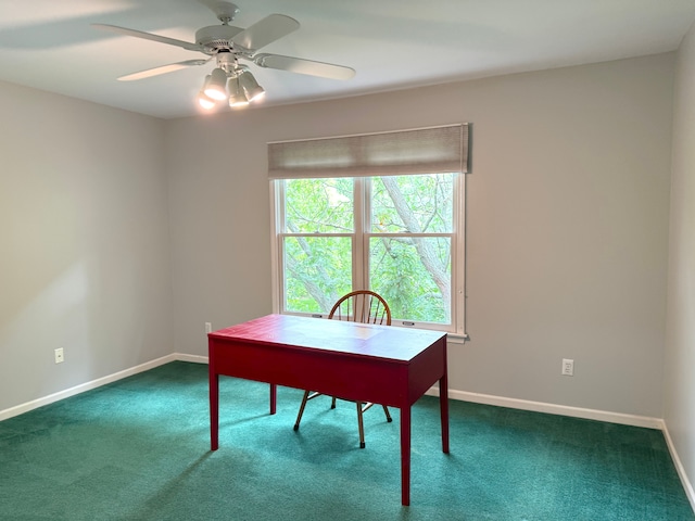 home office with carpet floors, a ceiling fan, and baseboards