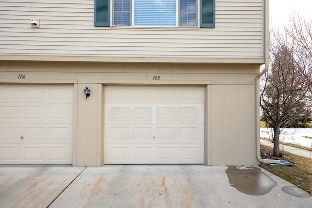 garage featuring driveway