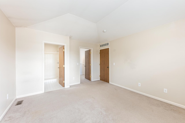 unfurnished bedroom featuring light carpet, baseboards, and visible vents