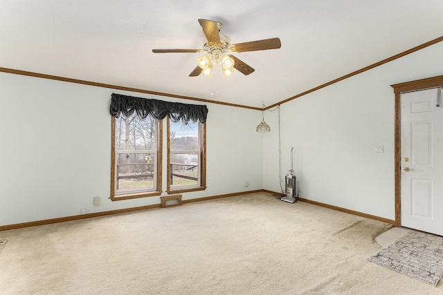 spare room with baseboards, ceiling fan, light colored carpet, and ornamental molding