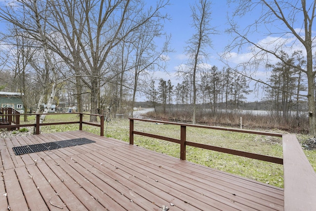 wooden deck featuring a water view