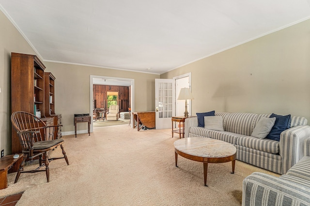 living room with french doors, light carpet, ornamental molding, and baseboards