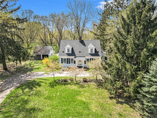 rear view of property with a yard and a chimney