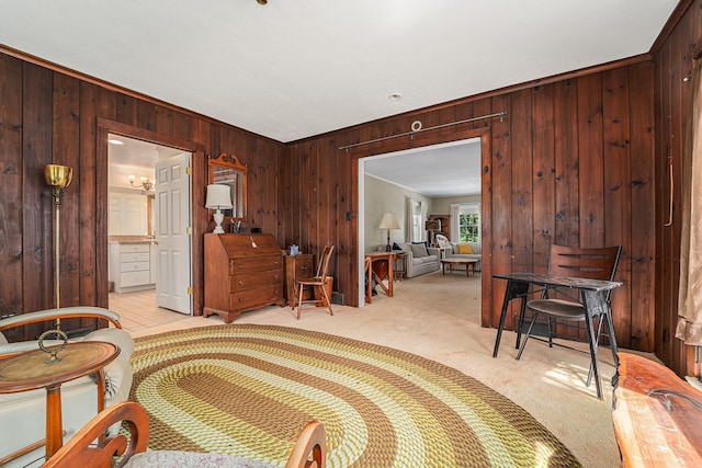 bedroom featuring wooden walls, light carpet, and crown molding
