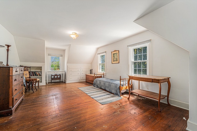 bedroom with hardwood / wood-style flooring and vaulted ceiling