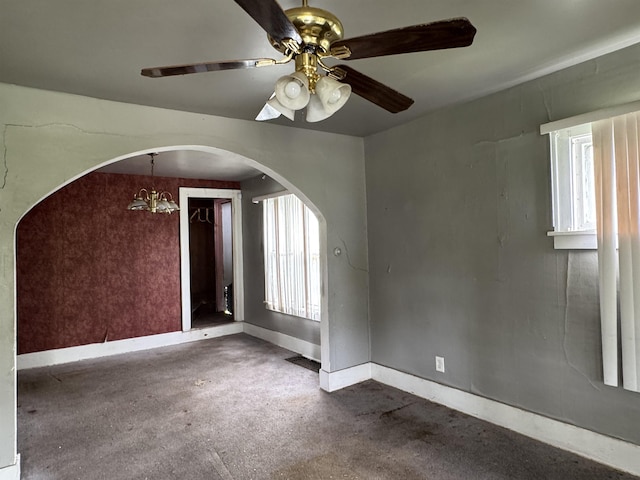 613 E Van Wagoner Ave, Flint, MI 48505 - empty room with arched walkways, a ceiling fan, plenty of natural light, and baseboards