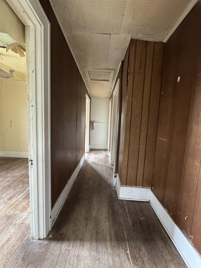 613 E Van Wagoner Ave, Flint, MI 48505 - corridor featuring hardwood / wood-style flooring, attic access, wood walls, and baseboards
