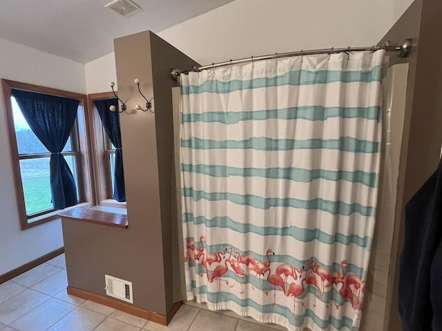 34722 36th Ave, Paw Paw, MI 49079 - bathroom with tile patterned floors, curtained shower, and baseboards